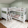 White wooden triple bunk bed with ladder, cozy quilts and patterned pillows against sage green paneled wall in children's bedroom