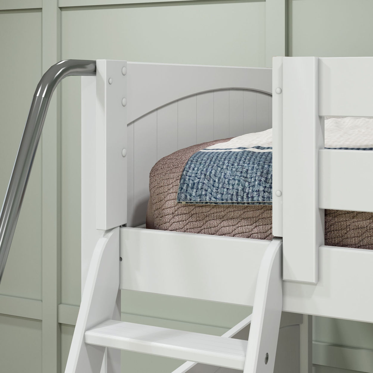 White bunk bed corner with blue and brown quilted bedding, featuring a sleek metallic slide and wooden ladder.