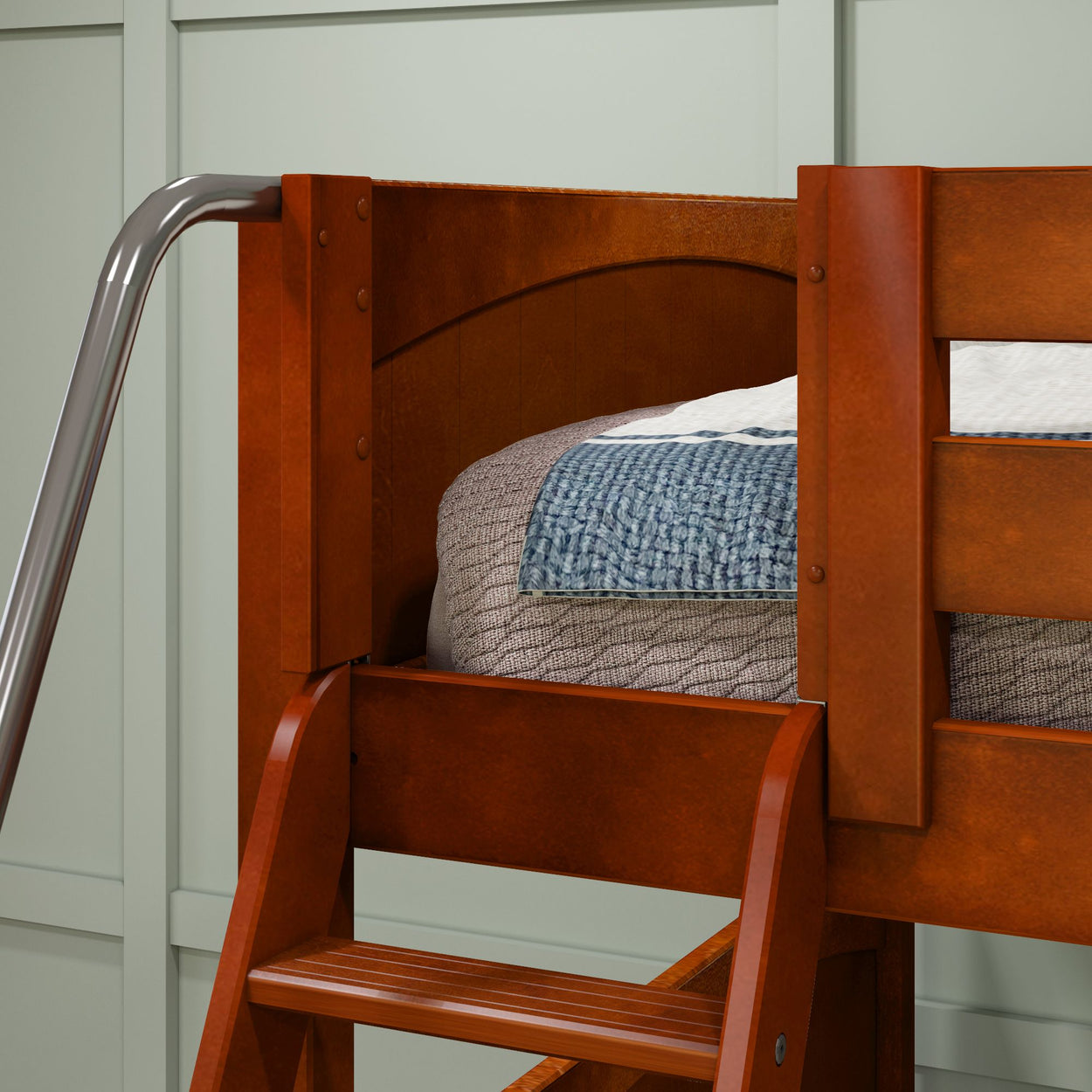 Wooden bunk bed close-up with safety ladder and quilted bedding set.