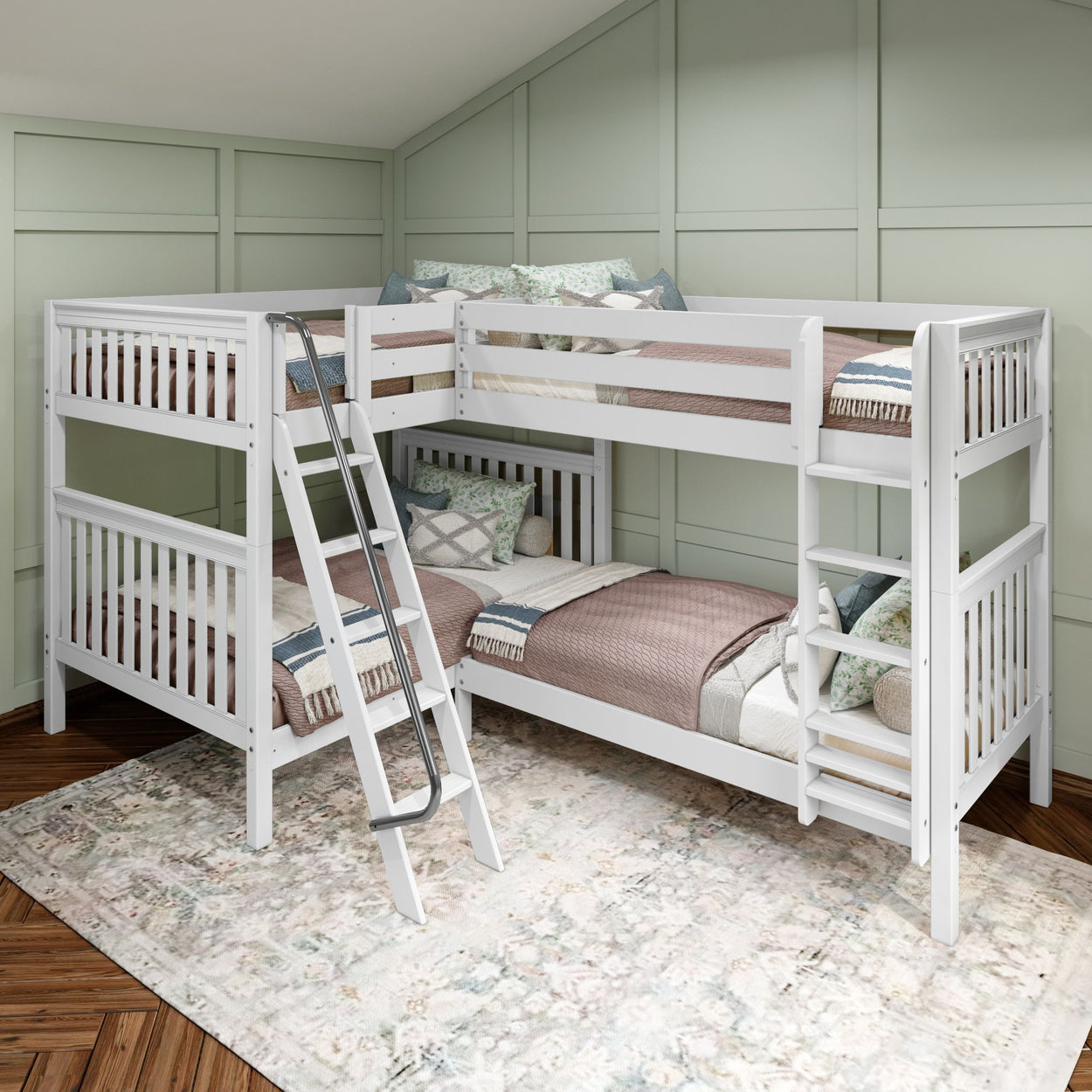 White wooden L-shaped bunk bed with ladder in a cozy attic room with pastel green walls and hardwood floor.