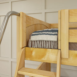 Wooden loft bed with striped bedding in a cozy bedroom setting.