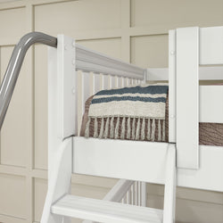 White bunk bed with striped blanket and safety railing in a modern bedroom setting.