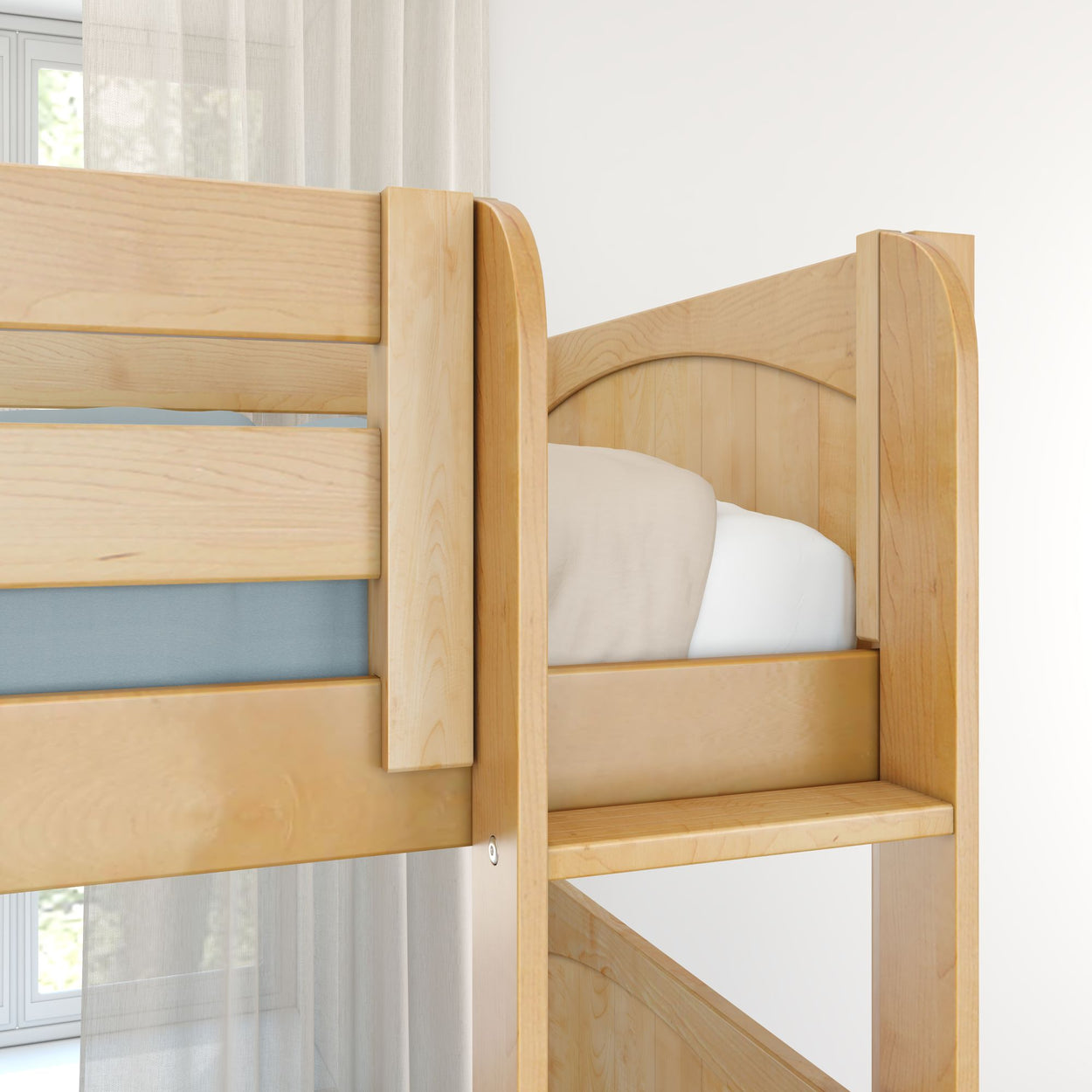 Close-up of solid light wood bunk bed with ladder, guardrail and beige bedding in bright modern bedroom interior