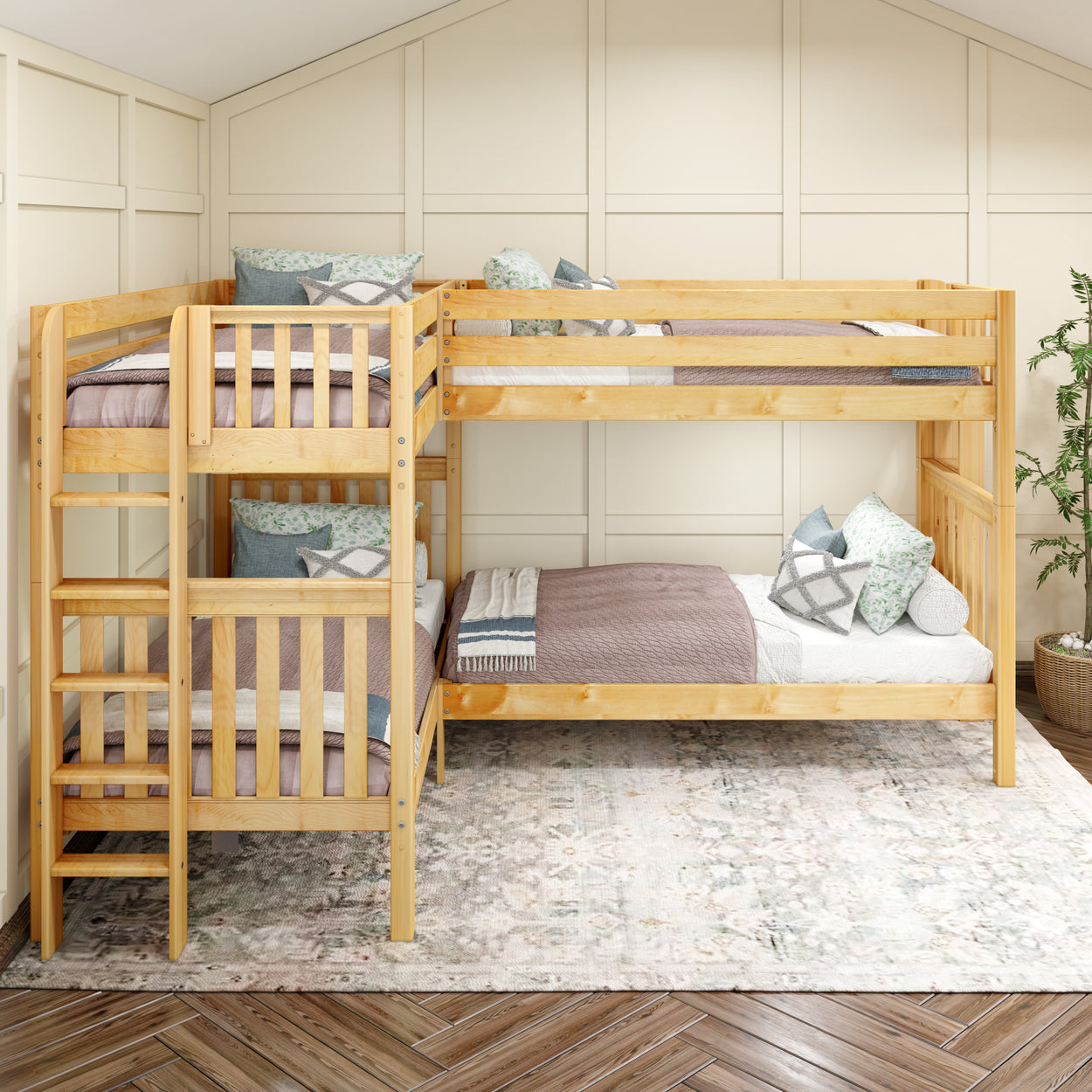 L-shaped wooden bunk bed with two twin over twin configurations in a cozy bedroom setting.