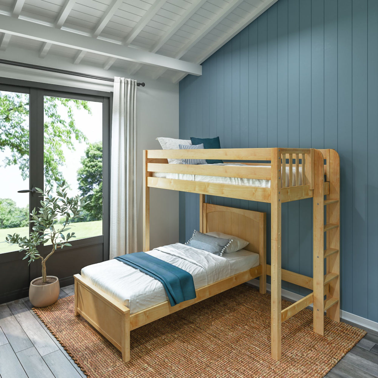Wooden bunk bed in modern bright room with large window and blue accent wall.
