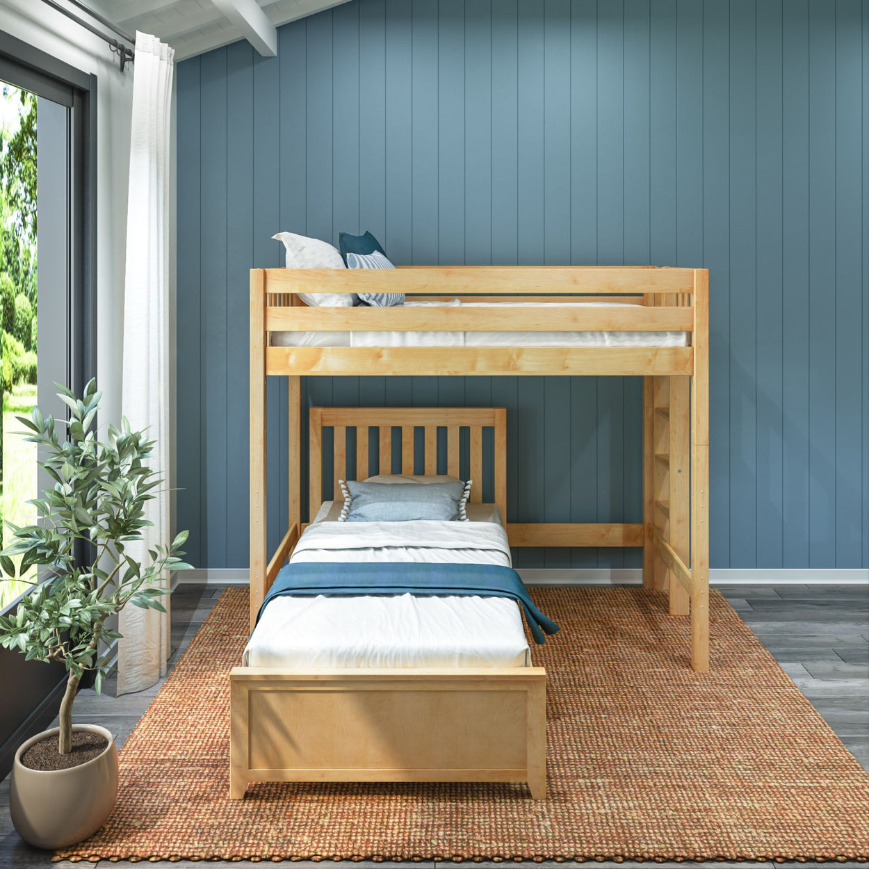 Wooden bunk bed in a modern bedroom with blue walls and a large window, featuring cozy bedding and a decorative plant.