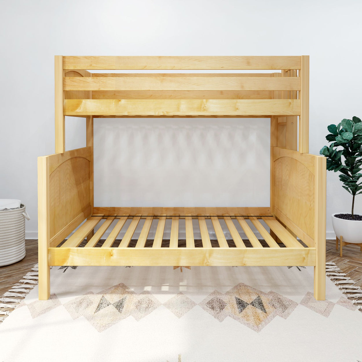 Wooden bunk bed without mattress in modern bedroom setting with decorative rug and plant.