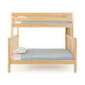 Light natural wood bunk loft bed with top guardrail and lower bed, blue quilt and white pillows, solid wood children's bedroom furniture