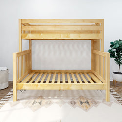 Natural wood bunk bed in modern bedroom with decorative rug and indoor plant.