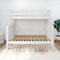 White wooden toddler loft bed frame with guardrails and slatted bed base in minimalist nursery with plant and woven basket