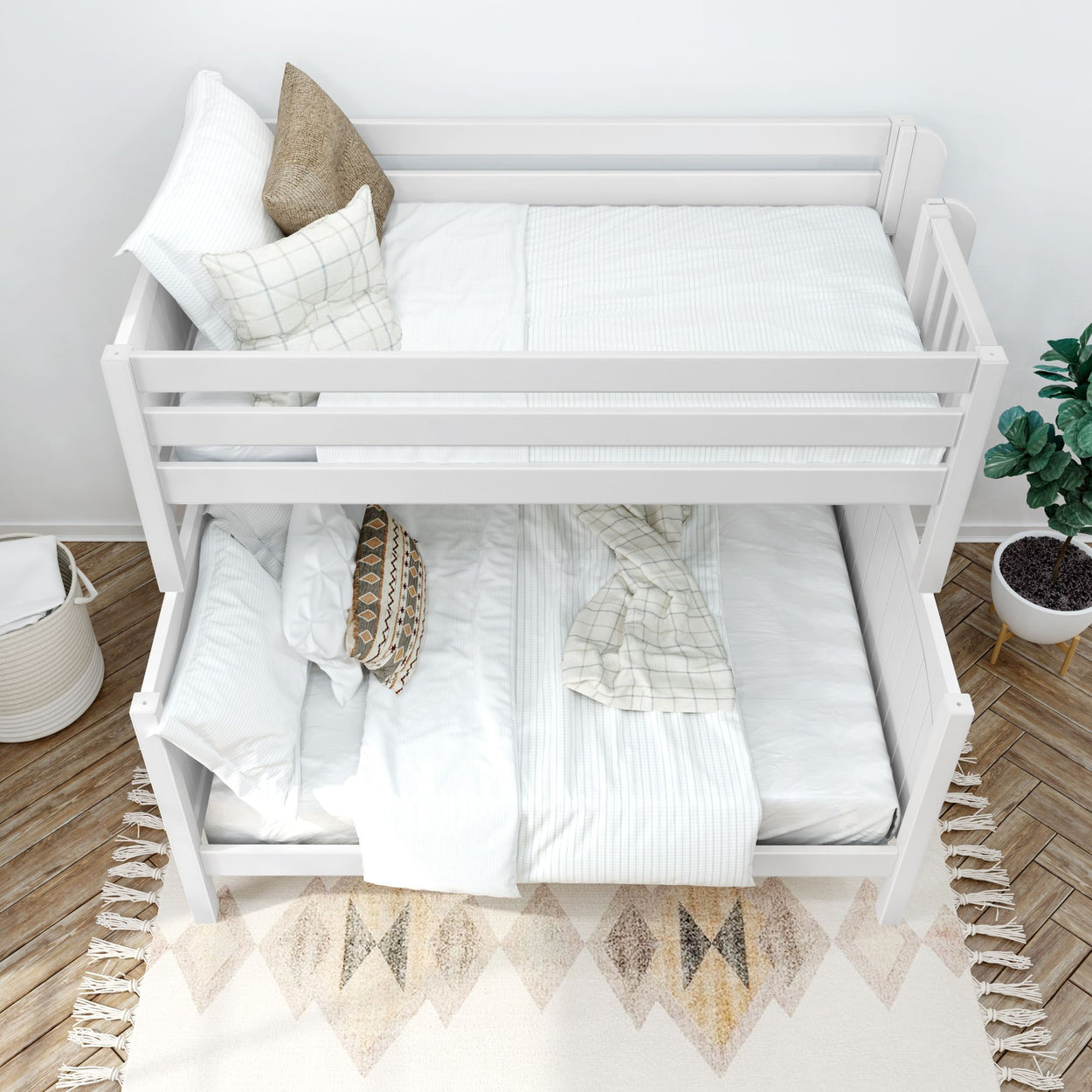 Modern children's white wooden bunk bed with cozy bedding and decorative pillows in a stylish bedroom.