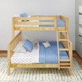 Natural wood twin-over-twin bunk bed with ladder, blue quilted bedding and star-print sheets in a space-saving kids nursery