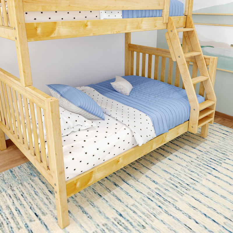 Natural pine wooden bunk bed with ladder, blue quilted bedding and star-print sheets in a kids' bedroom on a striped area rug