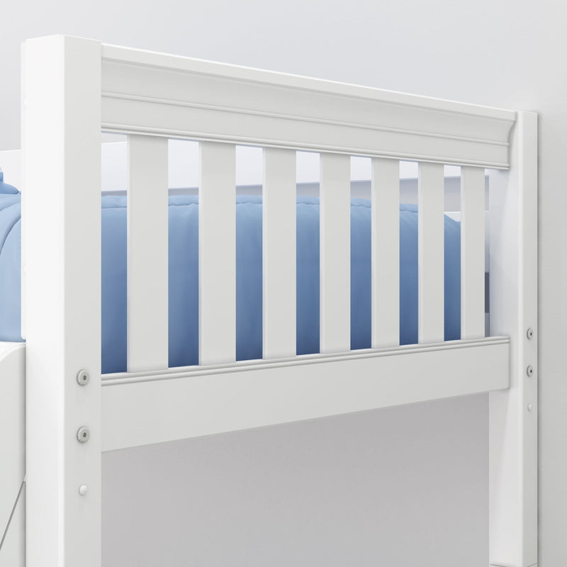 White wooden baby crib rail close-up with vertical slats and blue bedding in a modern nursery — safety rails