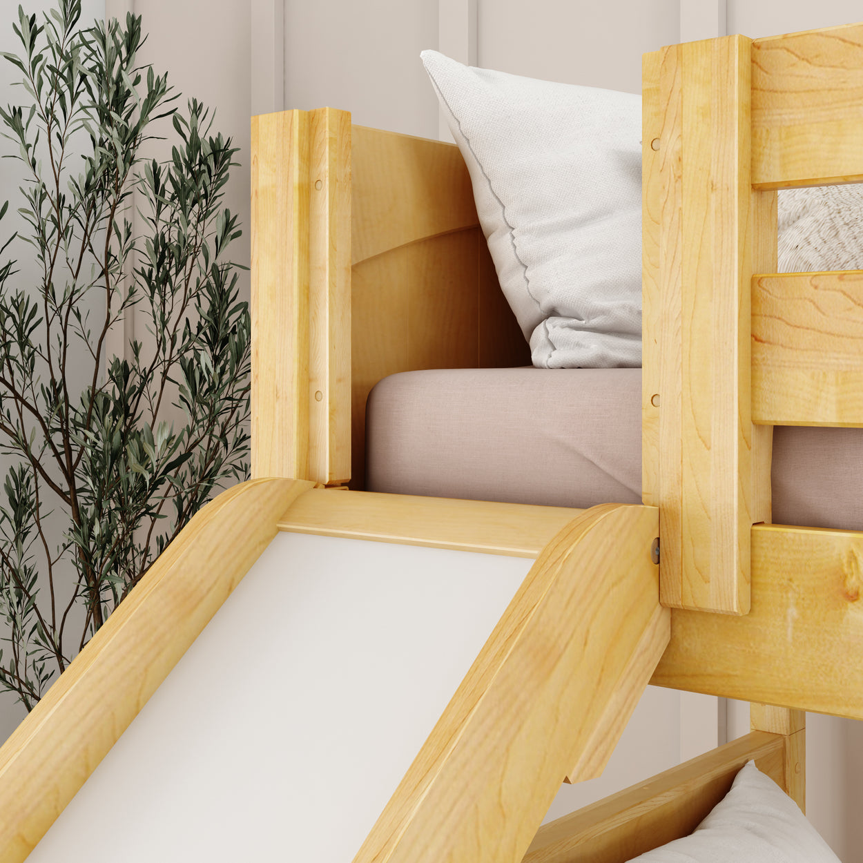 Bunk bed with slide and pillow, designed with natural wood, ideal for children's bedroom decor.