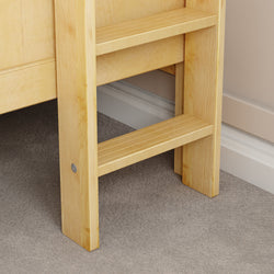 Wooden bunk bed ladder close-up in a cozy bedroom setting.