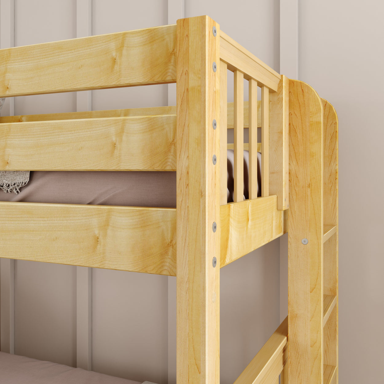 Wooden bunk bed corner with beige bedding and ladder against a light wall.