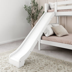 White wooden bunk bed with slide in a cozy bedroom setting.