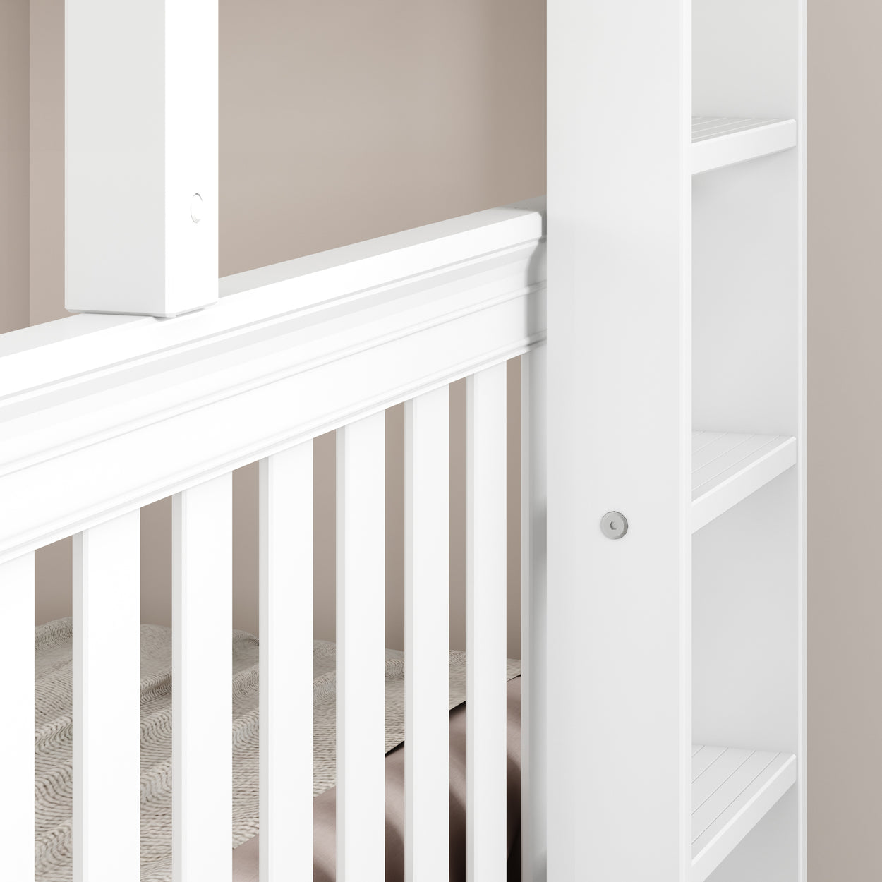 White wooden crib with slatted design and built-in shelves, ideal for a modern nursery.