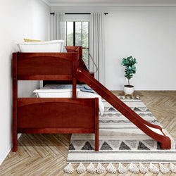 Wooden bunk bed with slide in modern bedroom featuring natural light and decorative rug.