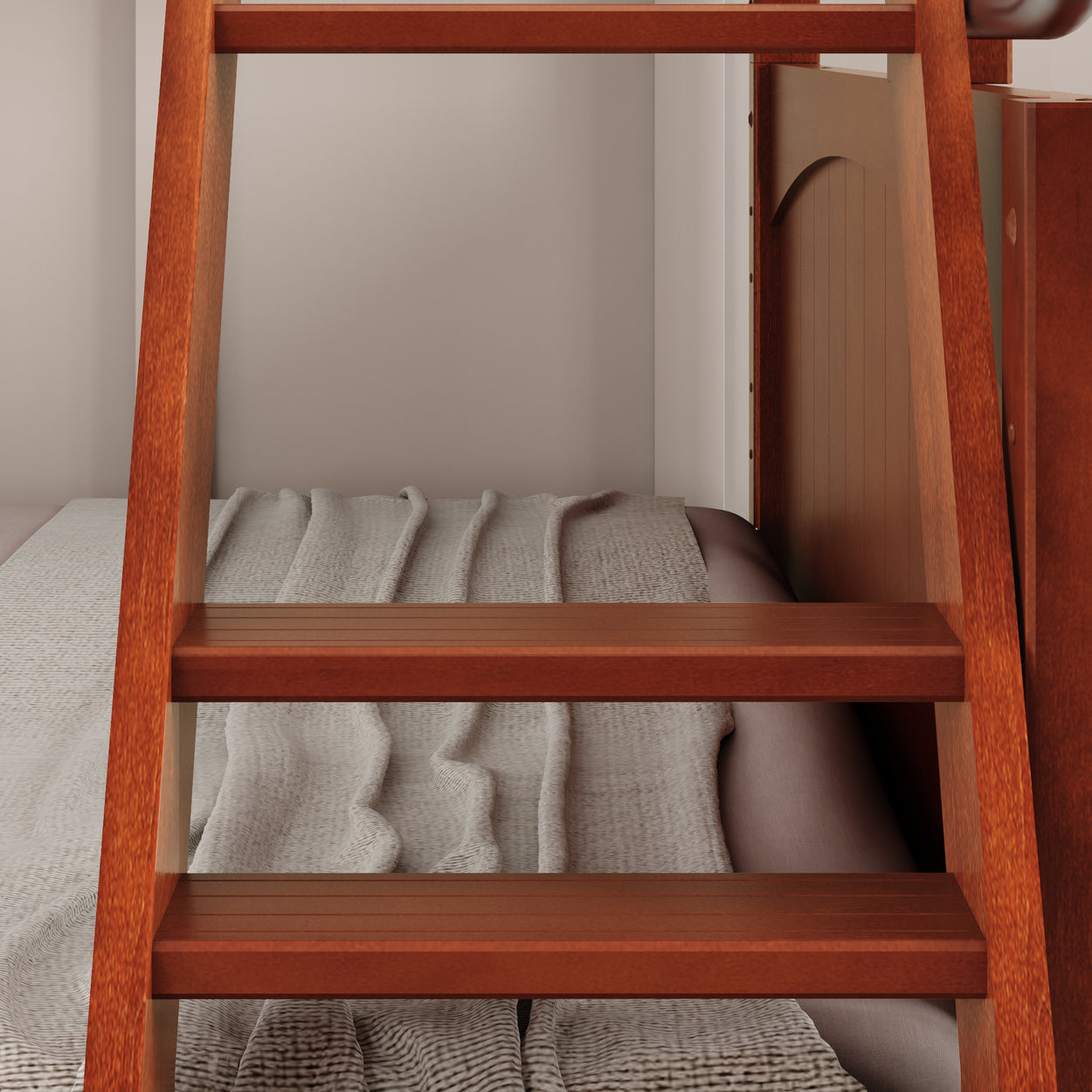Wooden bunk bed ladder leading to a cozy top bunk with folded blankets.