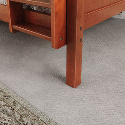 Wooden bunk bed ladder with carpeted flooring details.