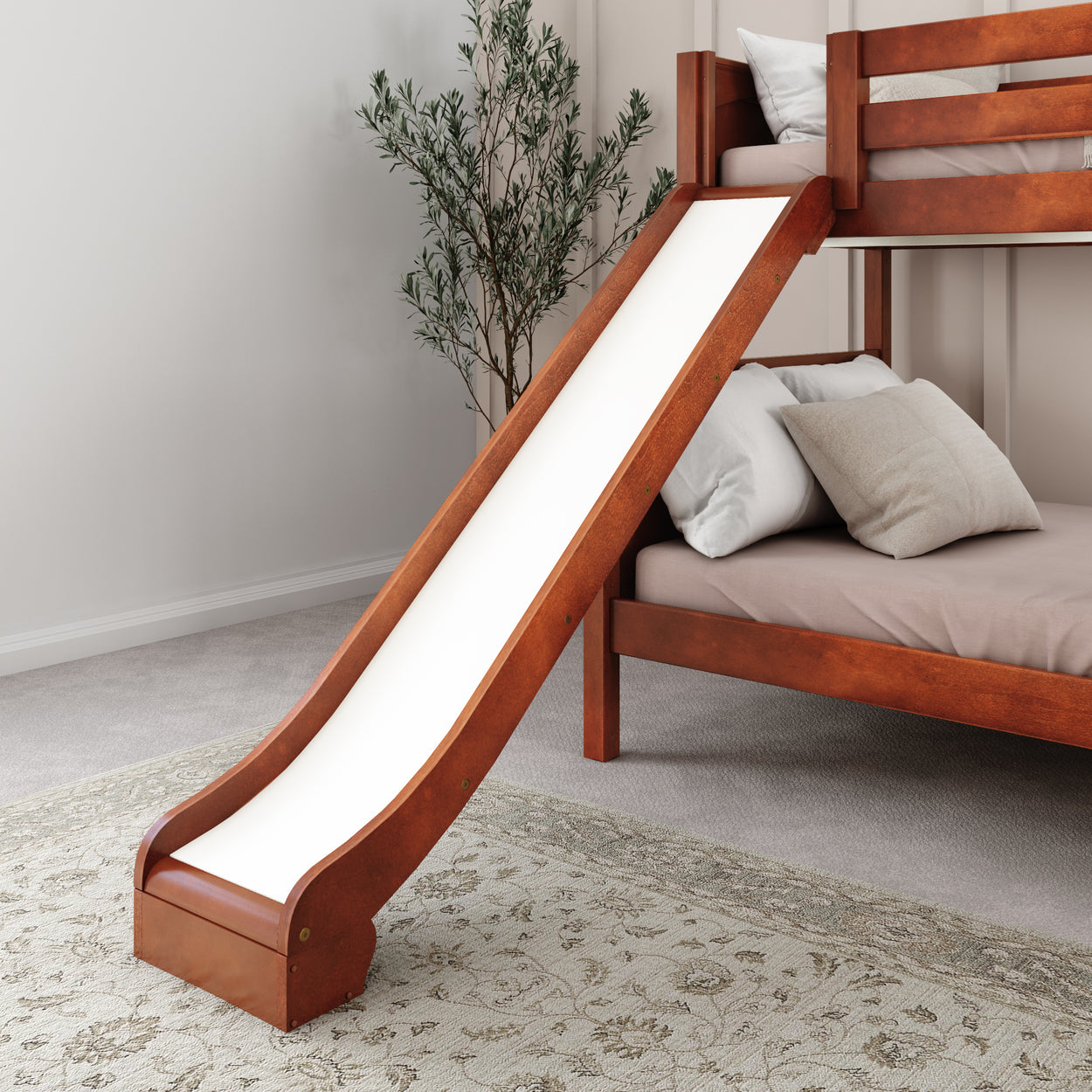 Wooden bunk bed with slide and pillows in a cozy bedroom.