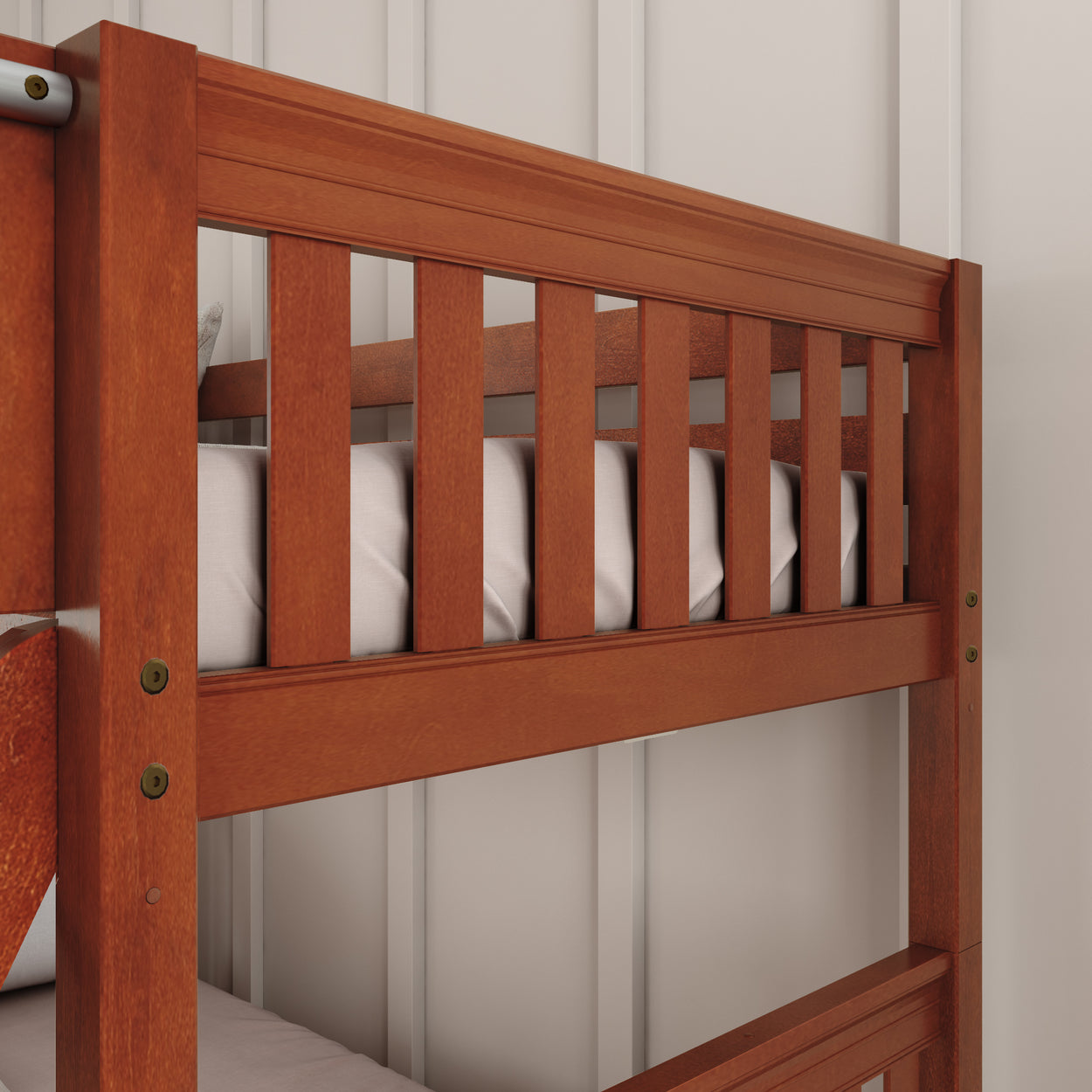 Wooden bunk bed with safety railings, perfect for children’s bedroom furniture.