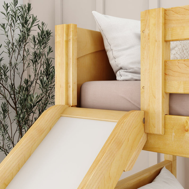 Wooden bunk bed with slide next to green plant in cozy modern bedroom.