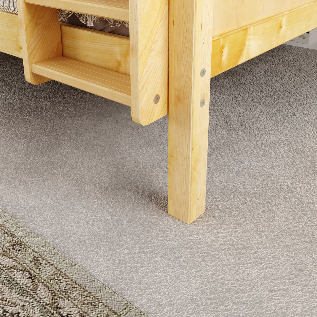 Wooden bunk bed ladder detail on plush gray carpet in modern bedroom.