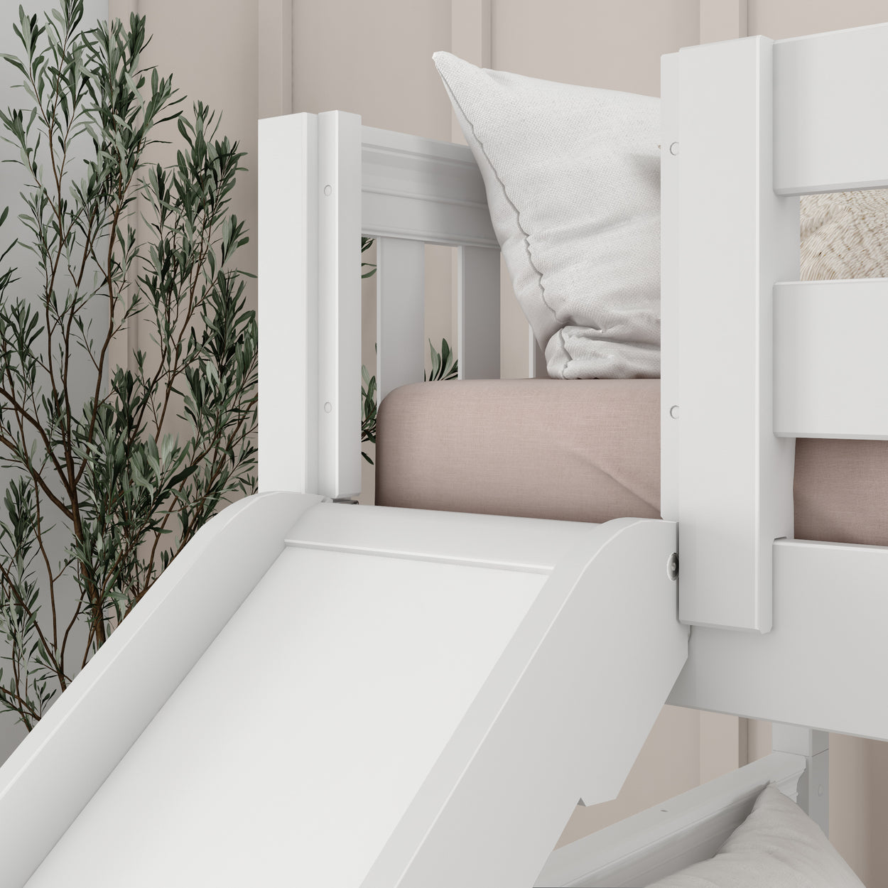 White children's bunk bed with slide and pillows, interior design for kids' room.