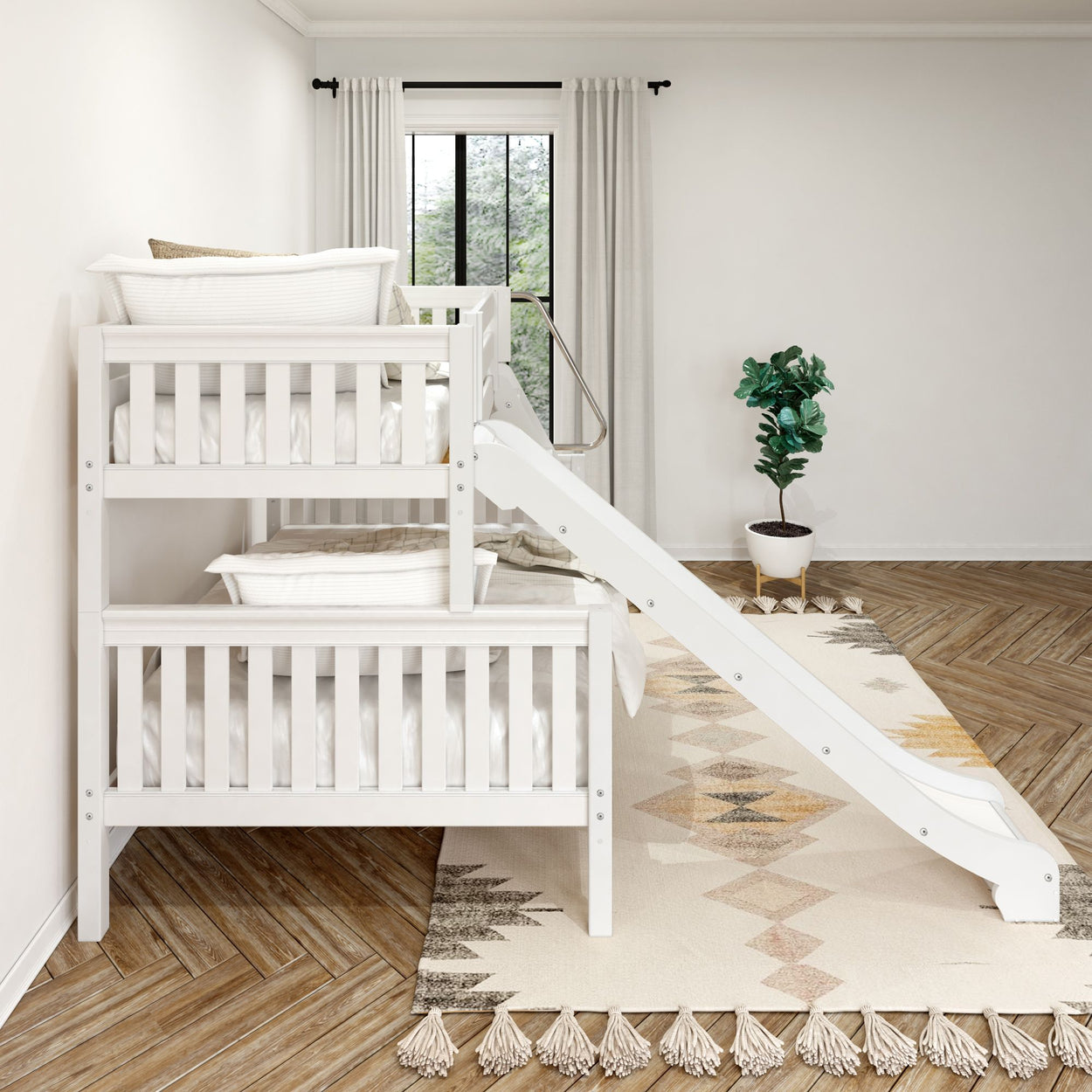 White wooden bunk bed with slide in modern kids' bedroom featuring cozy patterned rug and potted plant.