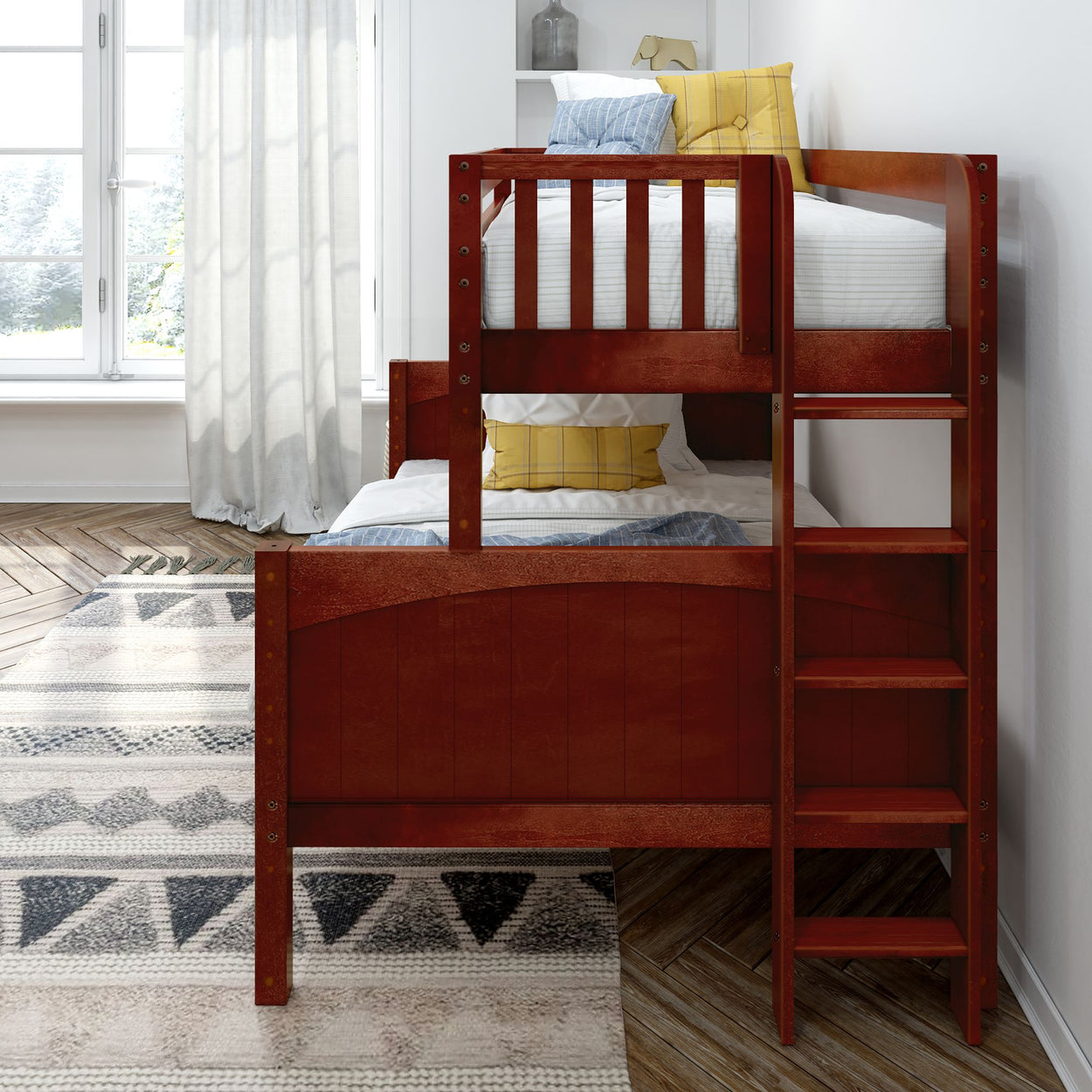 Wooden bunk bed with ladder in a bright bedroom, featuring white and yellow pillows, next to a large window and patterned rug.