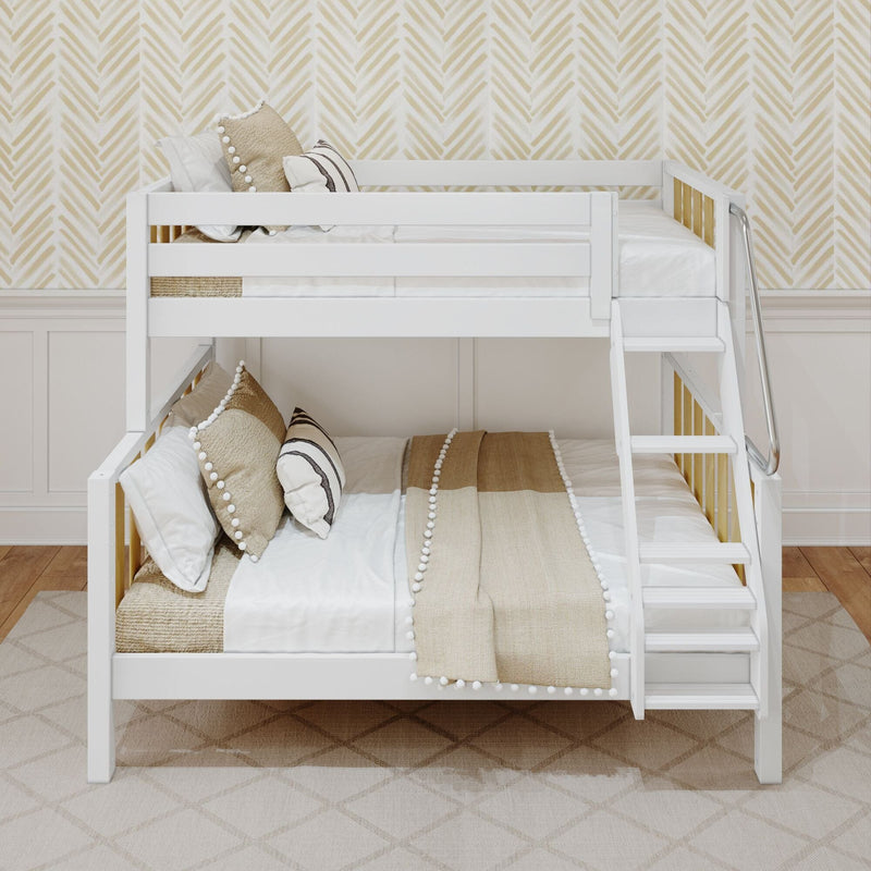 White wooden bunk bed with ladder, neutral beige pom-pom pillows and textured throw blankets against chevron wallpaper in a modern kids' bedroom
