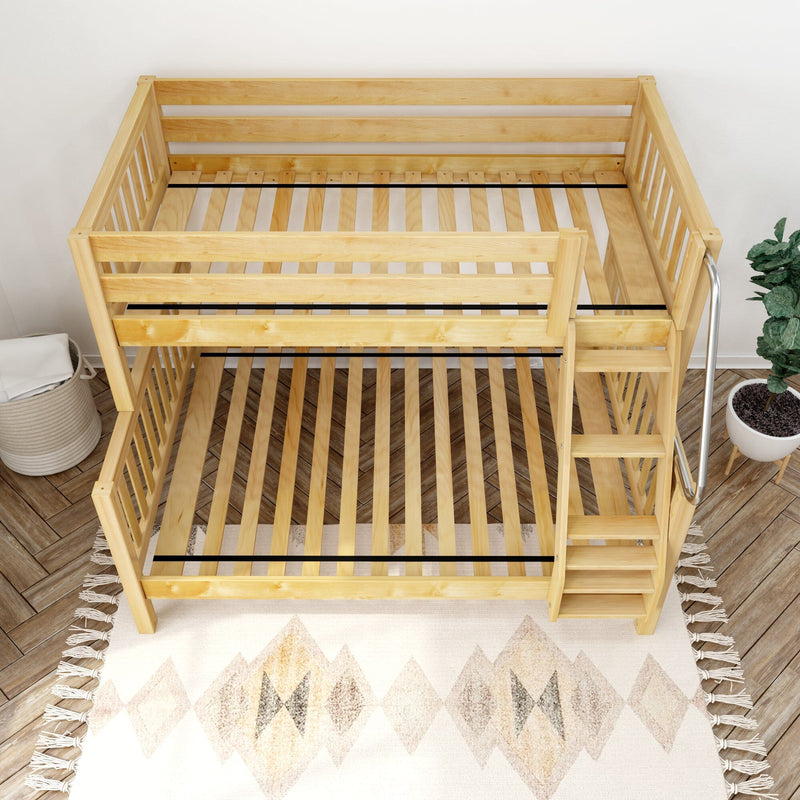 Top-down view of a natural wood bunk bed frame with slatted platforms and side staircase in a modern children's bedroom featuring a geometric rug and potted plant — space-saving pine loft bed design