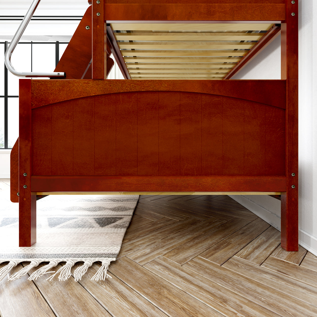 Wooden bunk bed frame with ladder in modern bedroom with herringbone flooring and area rug.