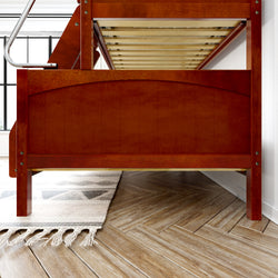 Wooden bunk bed frame with ladder in modern bedroom with herringbone flooring and area rug.
