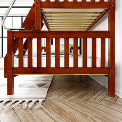 Wooden bunk bed with ladder in modern bedroom on herringbone wood floor.