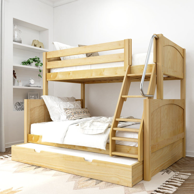 Natural pine wooden bunk bed with trundle drawer and angled ladder in bright modern kids bedroom, white bedding and decorative pillows