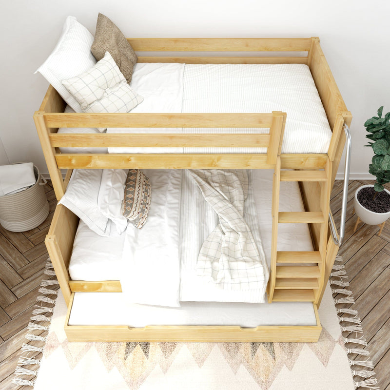 Natural wood bunk bed with pull-out trundle and ladder, white bedding and neutral pillows on patterned rug — space-saving kids' bedroom furniture