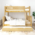 Natural pine wooden bunk bed with pull-out trundle and ladder, white bedding and neutral decor in a modern, space-saving kids bedroom