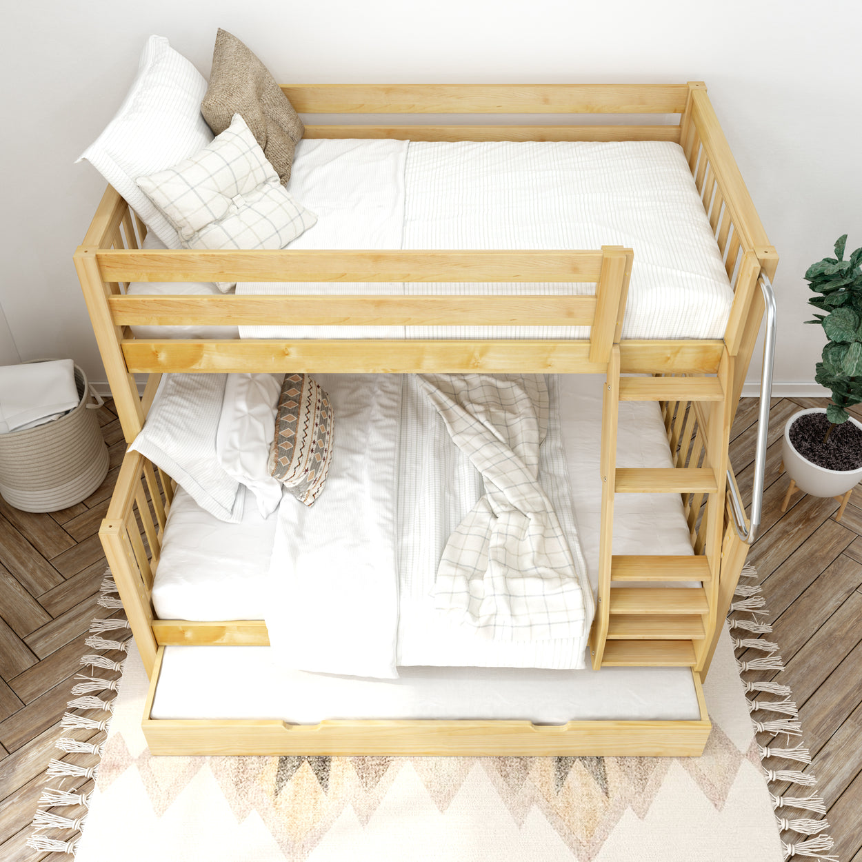 Natural wood bunk bed with white bedding and pillows in a cozy room with hardwood flooring and a plush area rug.
