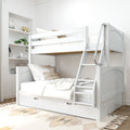 White wooden bunk bed with ladder and trundle drawer in modern neutral kids' bedroom with cozy bedding, pillows and built-in shelving