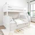 White wooden twin-over-full bunk bed with trundle, angled ladder and storage drawer, neutral bedding in a bright modern bedroom