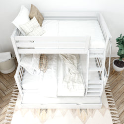 White wooden bunk bed with crisp white bedding in a cozy bedroom setting, featuring a decorative rug and potted plant.