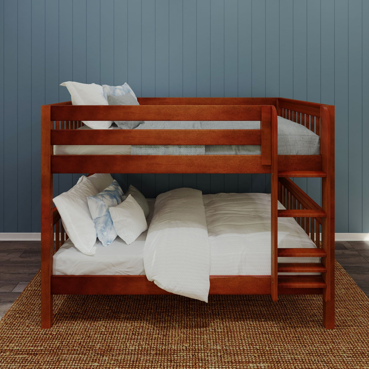 Wooden bunk bed with blue wall background and white bedding.