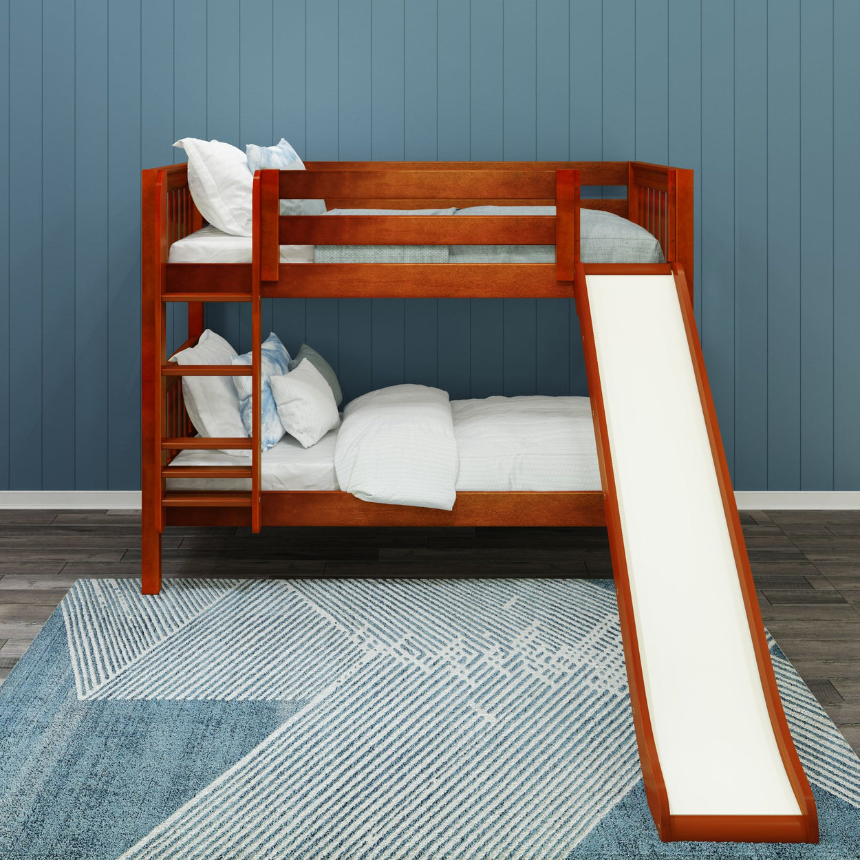 Wooden bunk bed with slide and bedding in modern blue room decor.