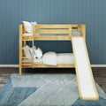 Natural wood bunk bed with slide in modern children's bedroom with blue paneled wall, white and blue bedding, and geometric blue area rug