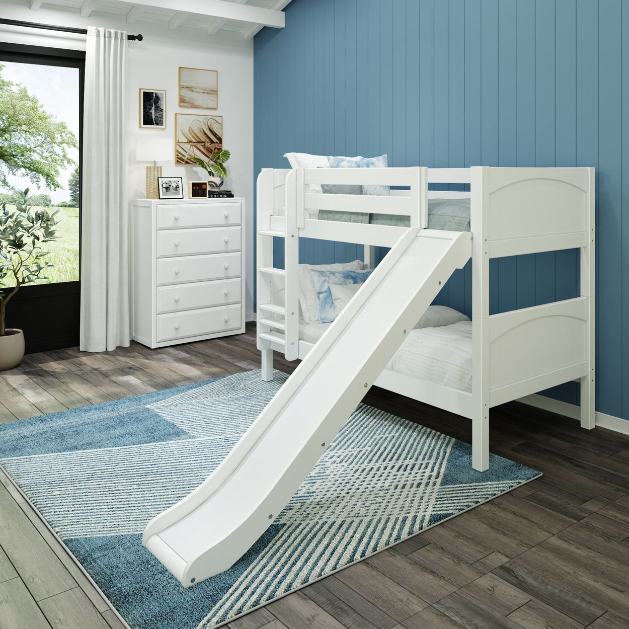 White wooden bunk bed with slide in modern children's room with blue walls and natural light.
