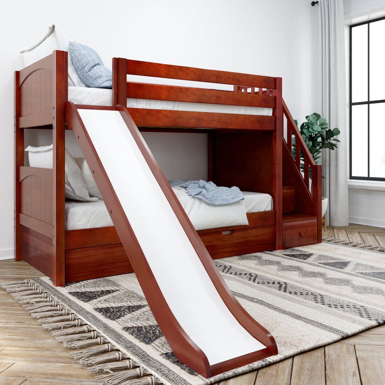 Children's wooden bunk bed with slide and stairs in modern bedroom.